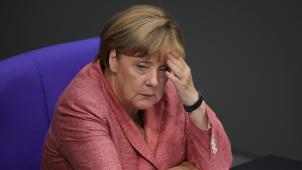 Le gouvernement d’Angela Merkel a déjà limité le droit d’asile. © Michael Kappeler/Reporters