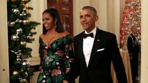 Michelle et Barack Obama arrivant dans la salle de réception
: dernier Noël à la Maison-Blanche. © Reuters.