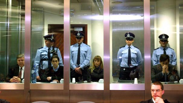 The accomplices of alleged Belgian pedophile Marc Dutroux (R), Belgian businessman Michel Nihoul (L), right-hand man Michel Lelievre (2nd L) and estranged wife Michelle Martin (2nd R), sit 29 March 2004 in the dock of the courthouse of the southeastern town of Arlon. Dutroux and his accomplices are charged with the kidnapping and rape of six girls and the deaths of four of them. (Photo by FRANCOIS LENOIR / POOL / AFP)