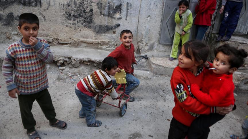 Image d’illustration d’enfants jouent dans un quartier de Tishreen © EPA